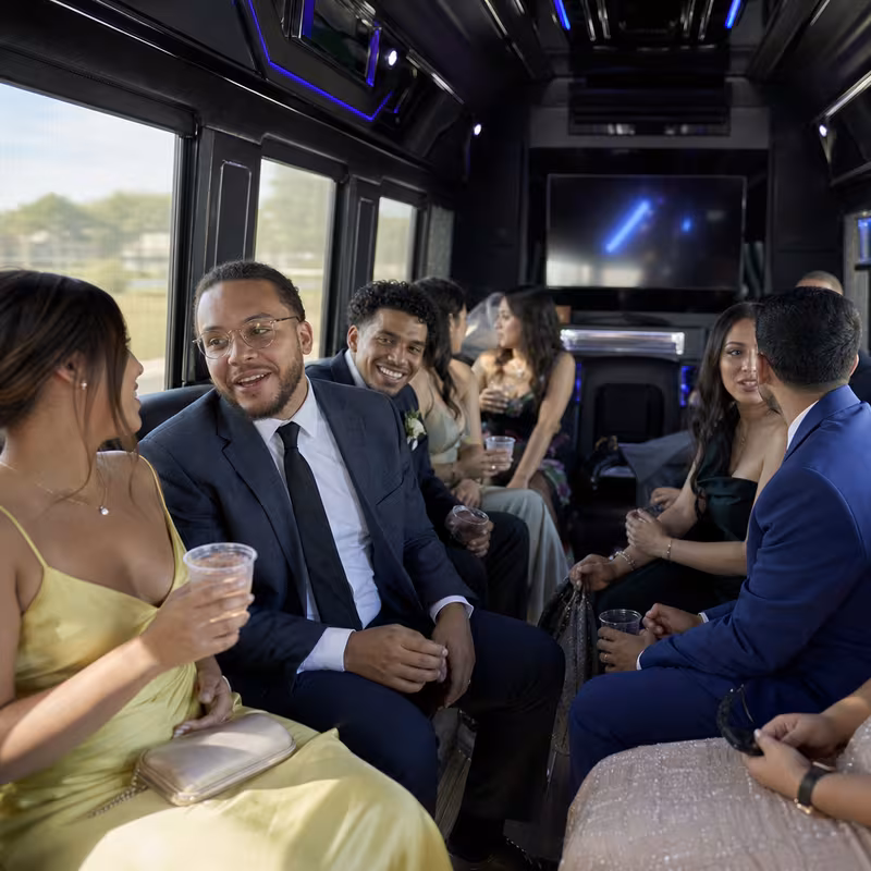 Wedding guests seated inside a New Brunswick party bus