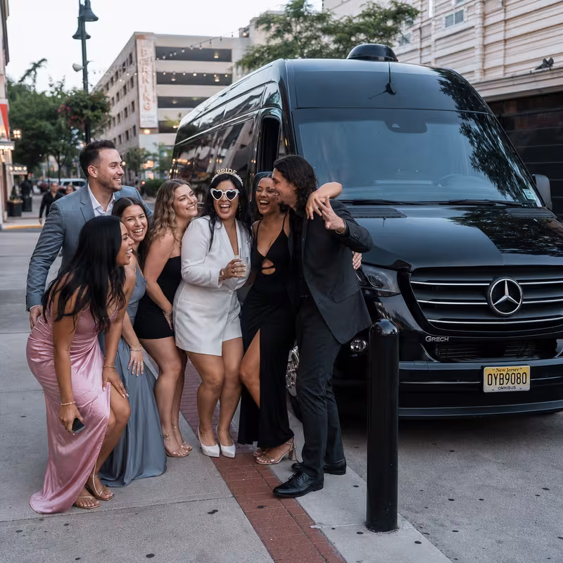 Group boarding a white charter bus for Bachelor & Bachelorette Transportation transportation in New Brunswick