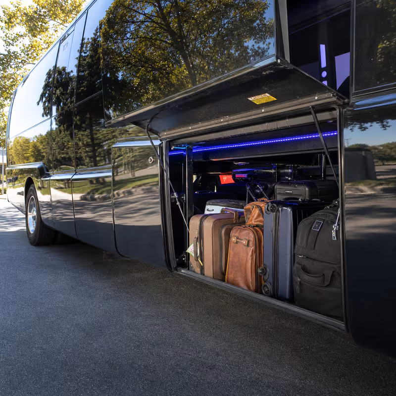 Party bus interior with wraparound leather seating and LED lighting in New Brunswick