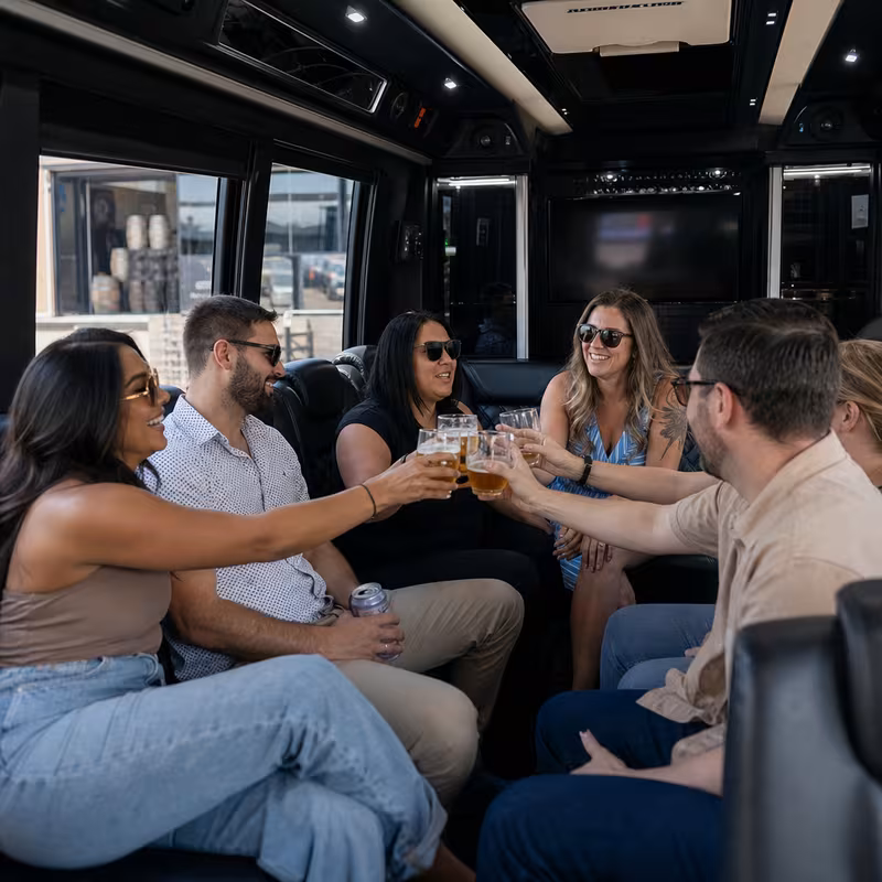Group boarding a white charter bus for Winery & Brewery Tour Transportation transportation in New Brunswick